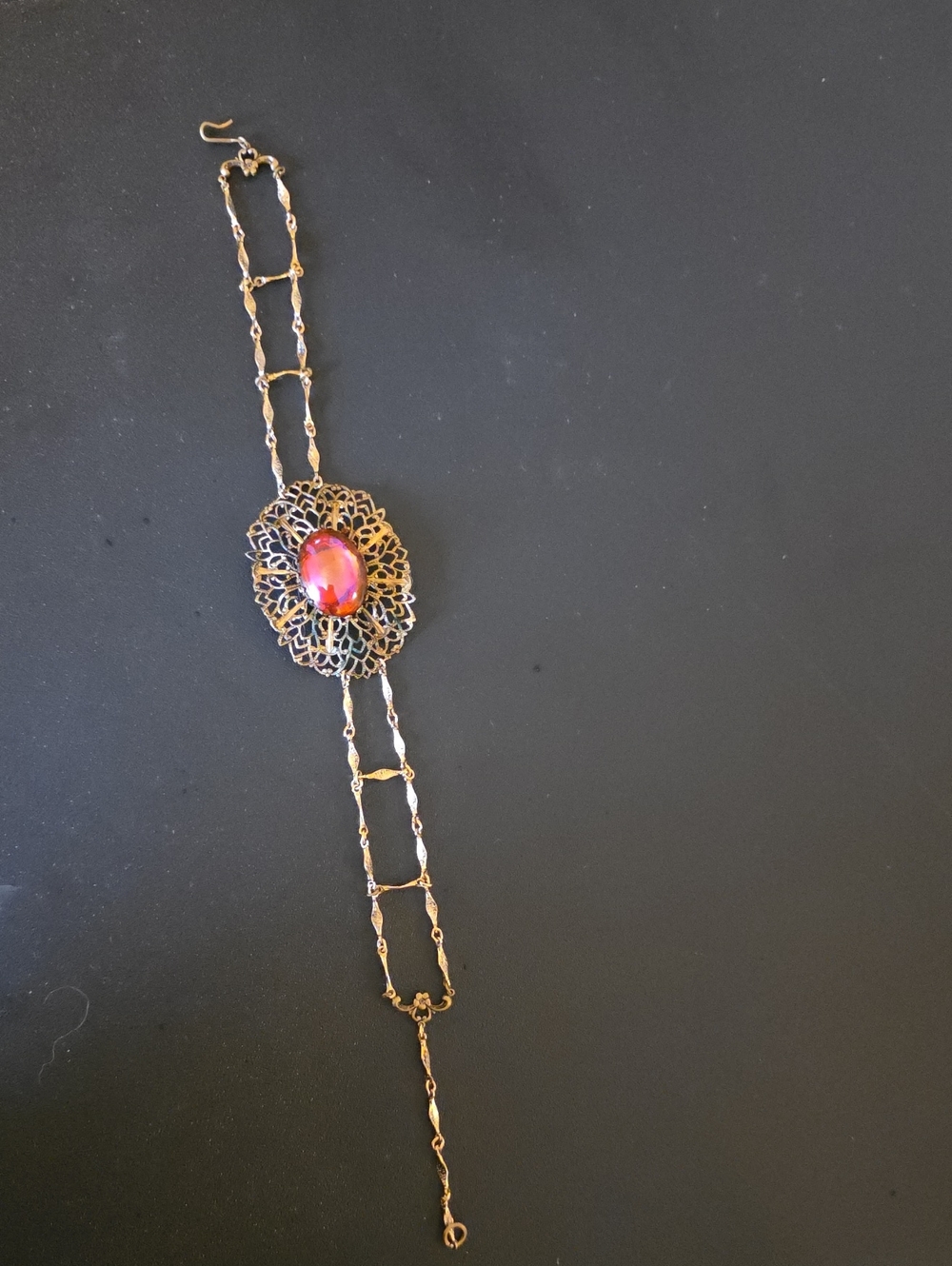 Gold Filigree Bracelet with Pink Red Cabochon Center